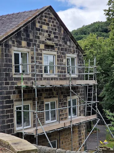 Scaffolded Yorkshire stone cottage mid-exterior works by Home Hues, frames prepared for painting