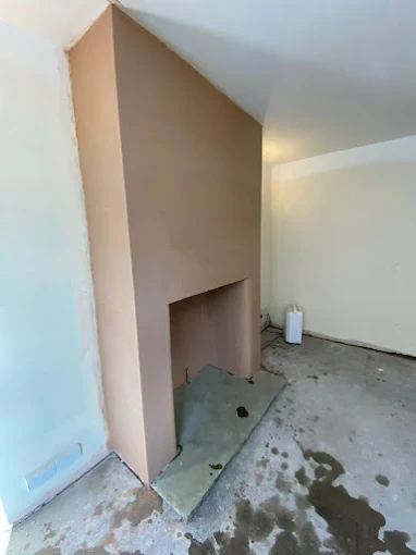 Chimney breast and alcove freshly plastered by Home Hues to a smooth finish